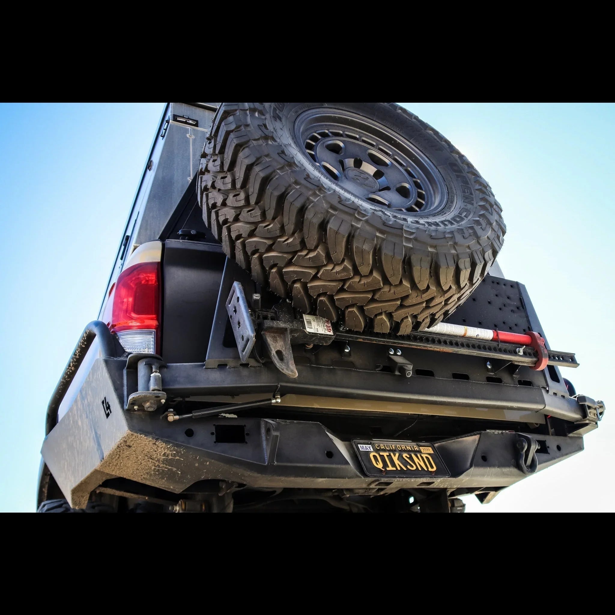 Toyota Tacoma overland rear bumper with spare tire and recovery gear mounted