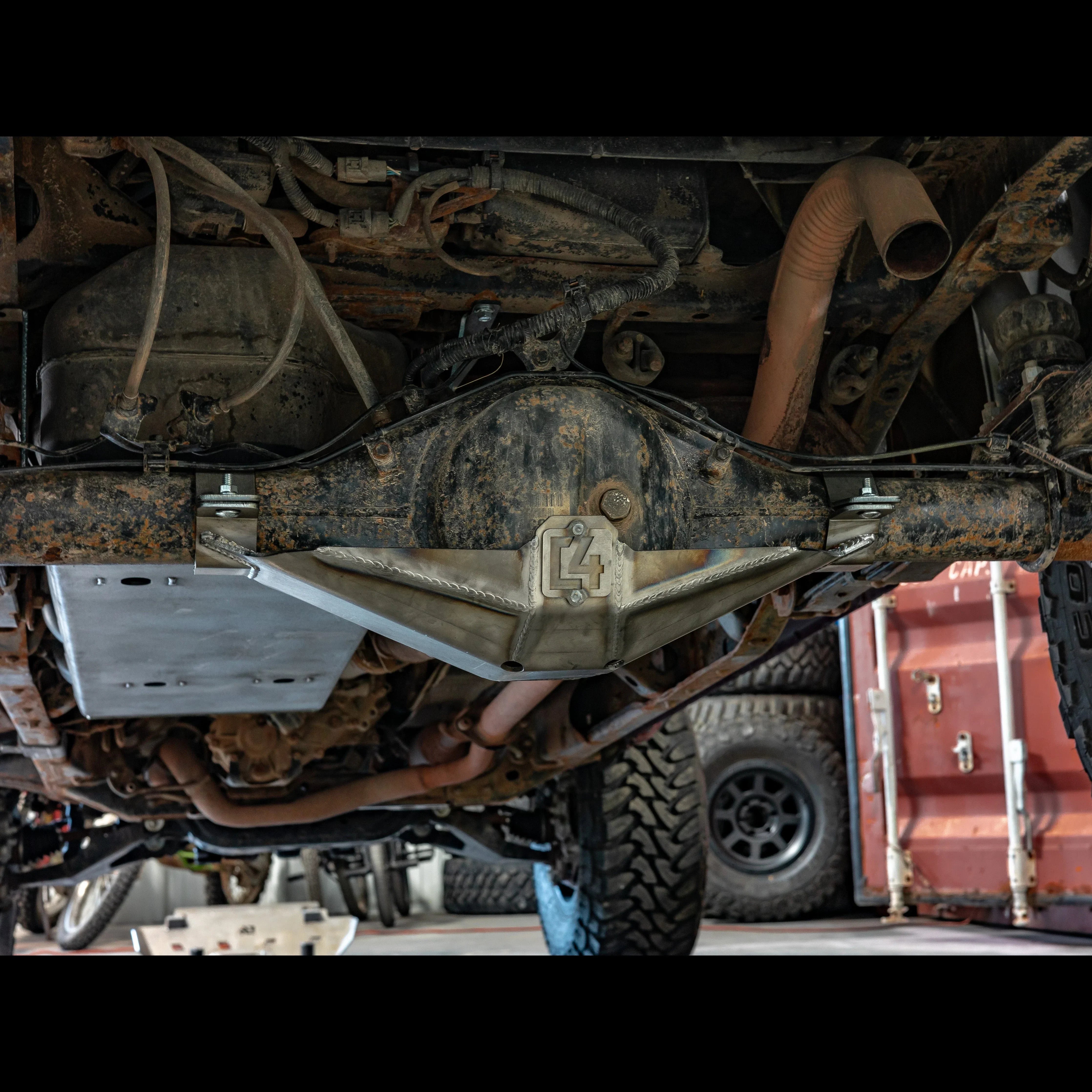 Toyota Tacoma rear differential skid plate installed, undercarriage view, off-road upgrade