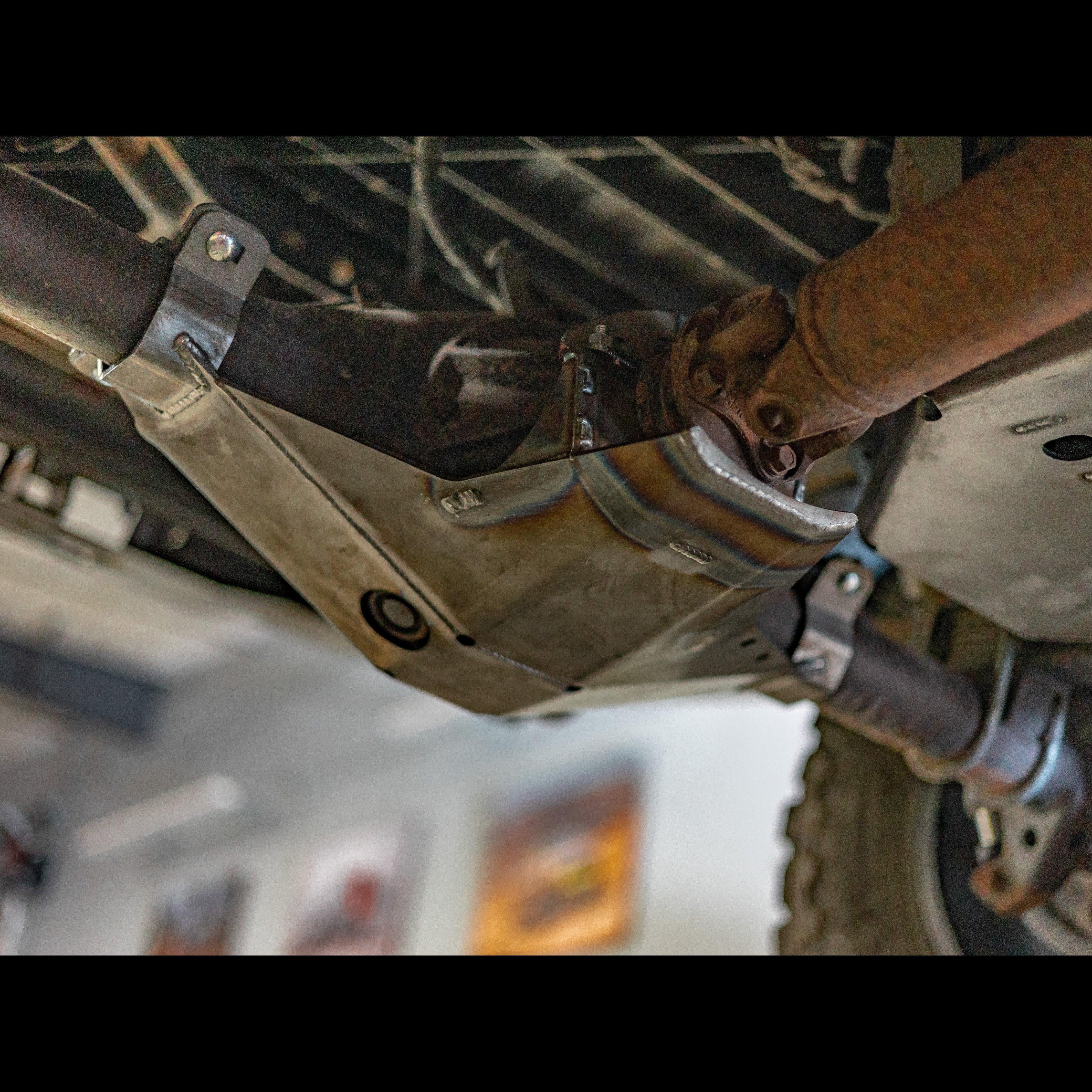 Steel rear differential skid plate installed under a Toyota Tacoma for off-road protection