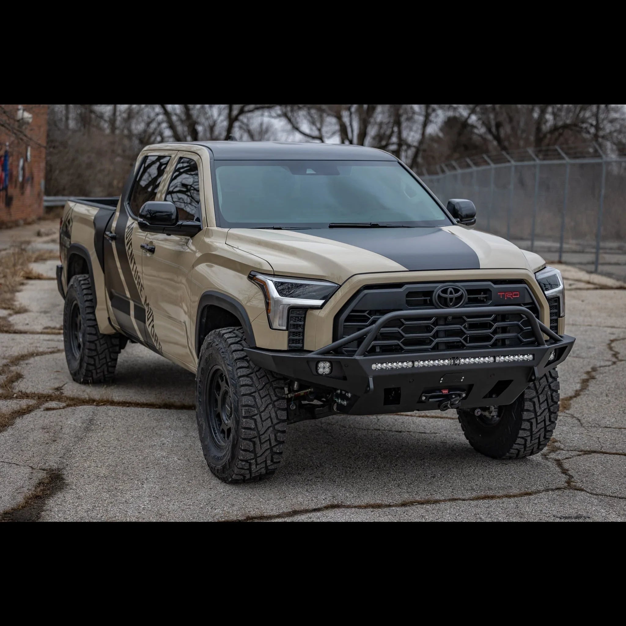 Toyota Tundra 2022 with overland front bumper and off-road accessories in urban setting