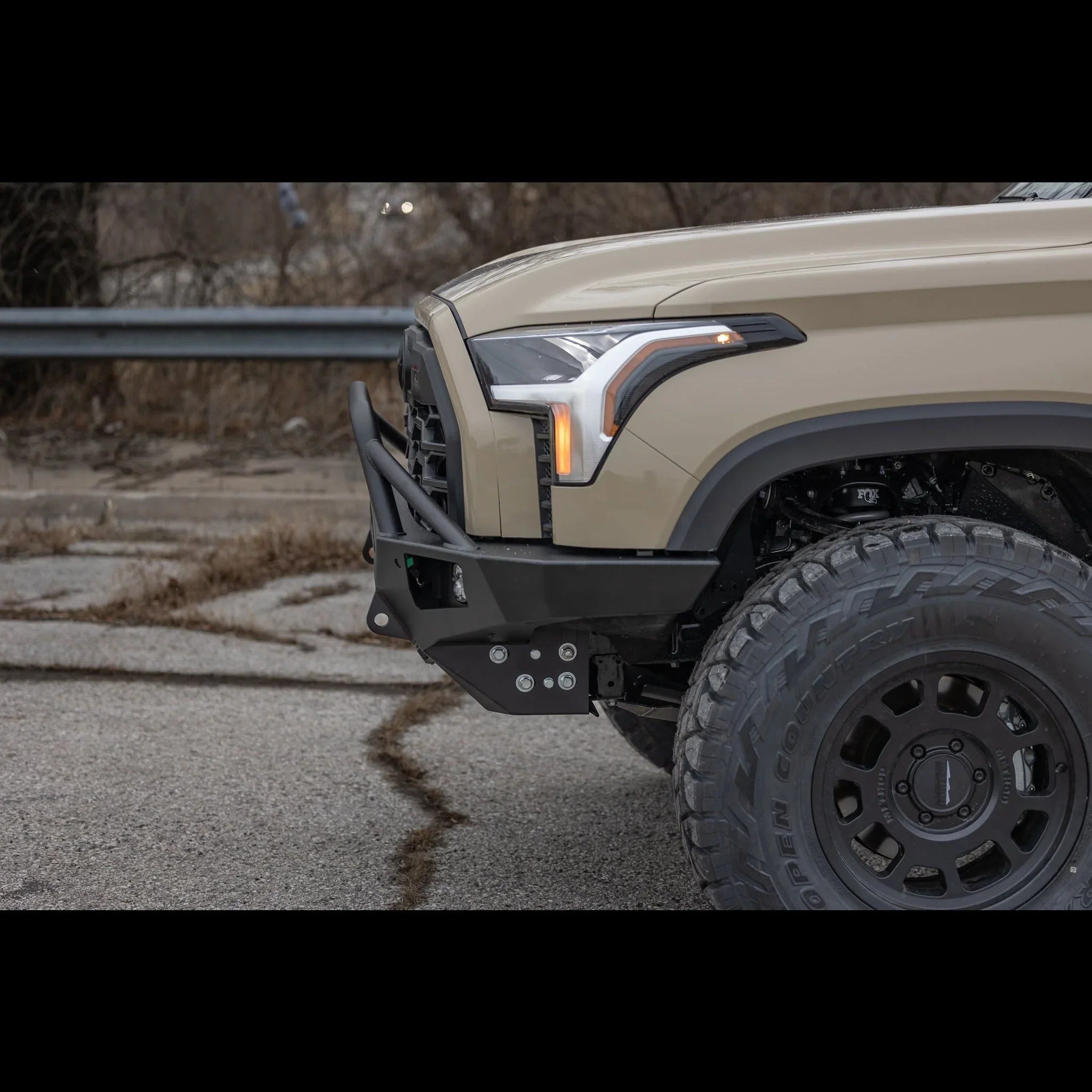 Toyota Tundra 3rd Gen with aftermarket overland front bumper and off-road tires