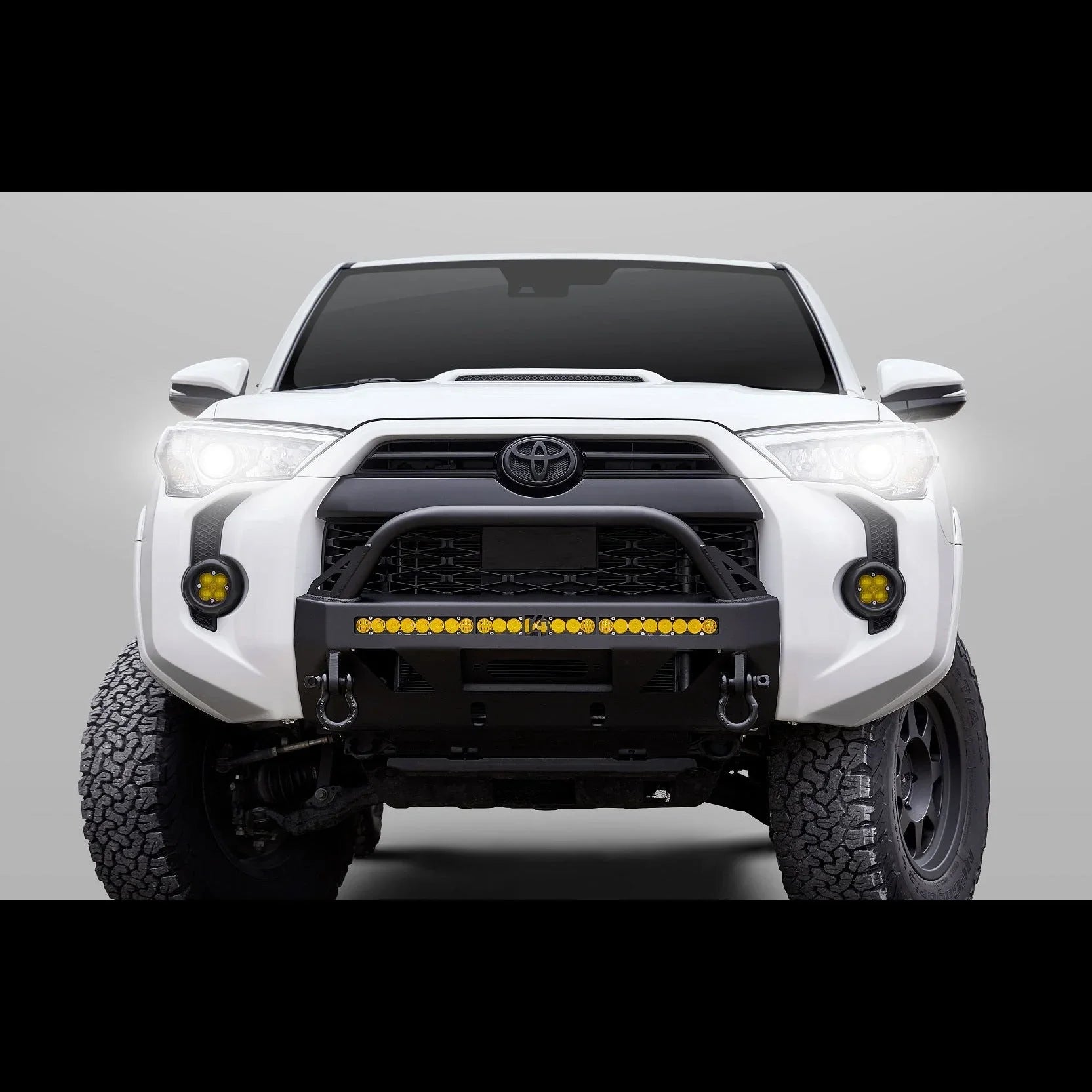 Toyota 4Runner front bumper with off-road lights, recovery hooks, and rugged tires