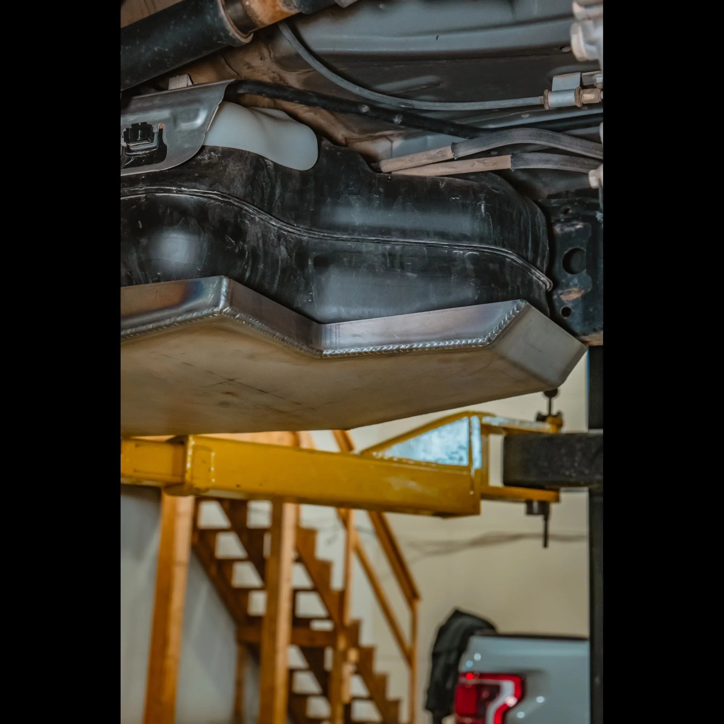 Aluminum gas tank skid plate installed on vehicle for overlanding protection