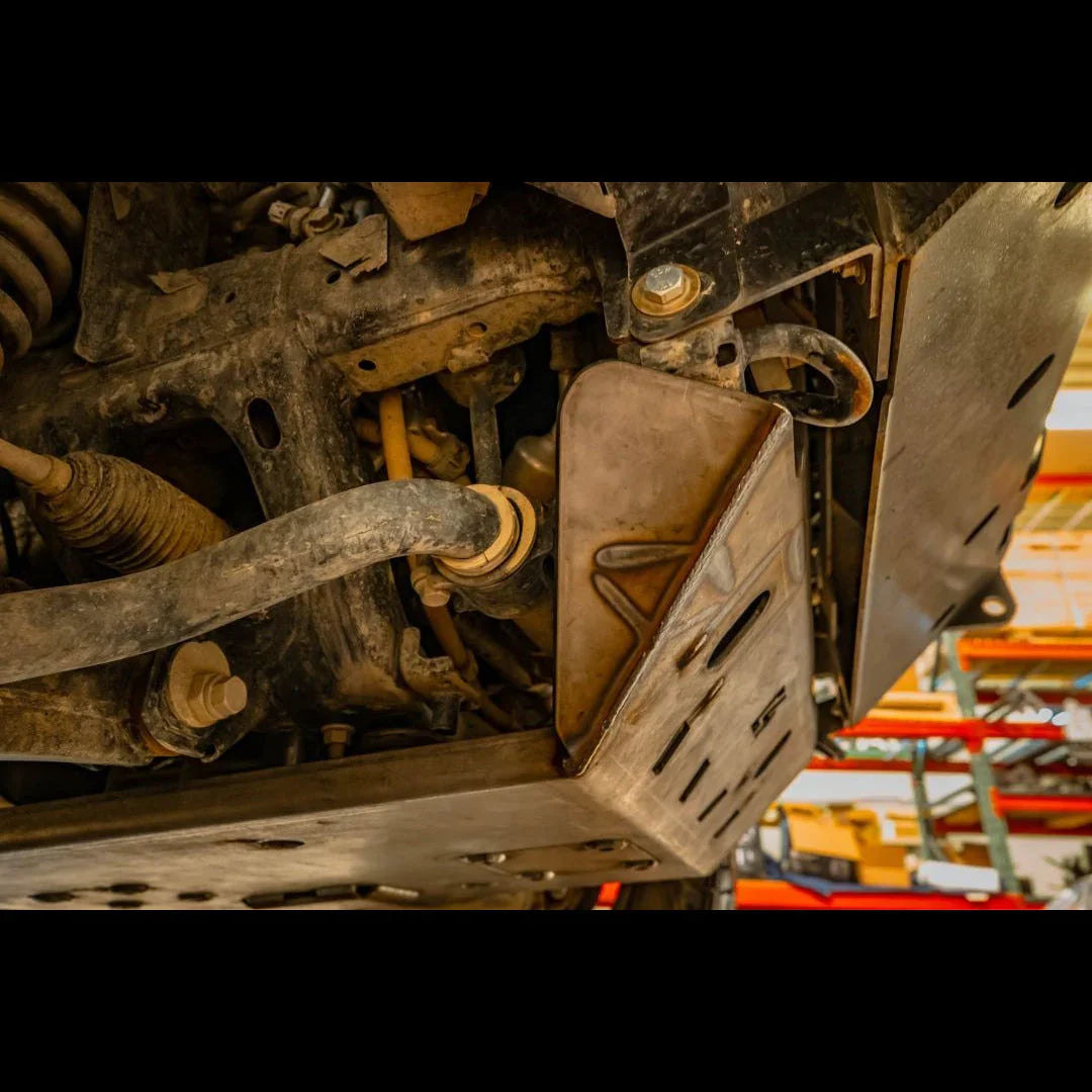 Close-up of off-road vehicle KDSS skid plate and suspension, undercarriage protection