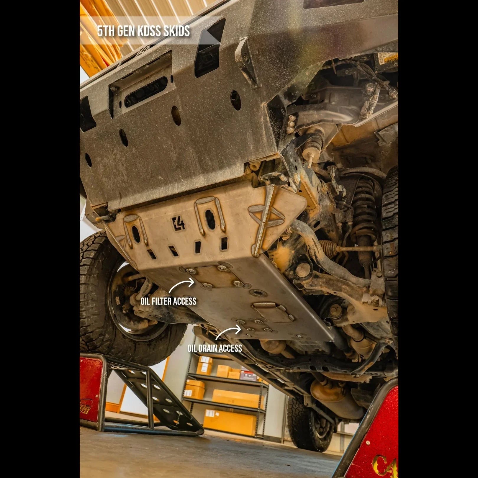 5th gen KDSS skid plate installed on off-road vehicle, showing oil filter and drain access