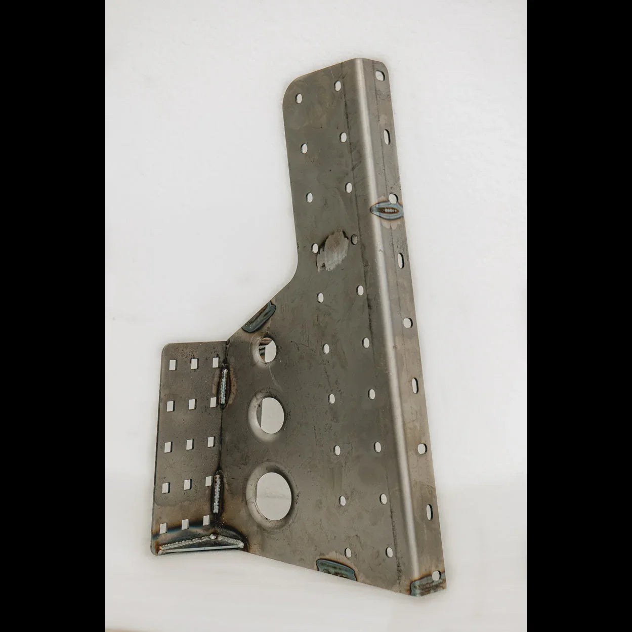 Steel rear bumper mounting bracket with multiple holes for off-road vehicle attachment