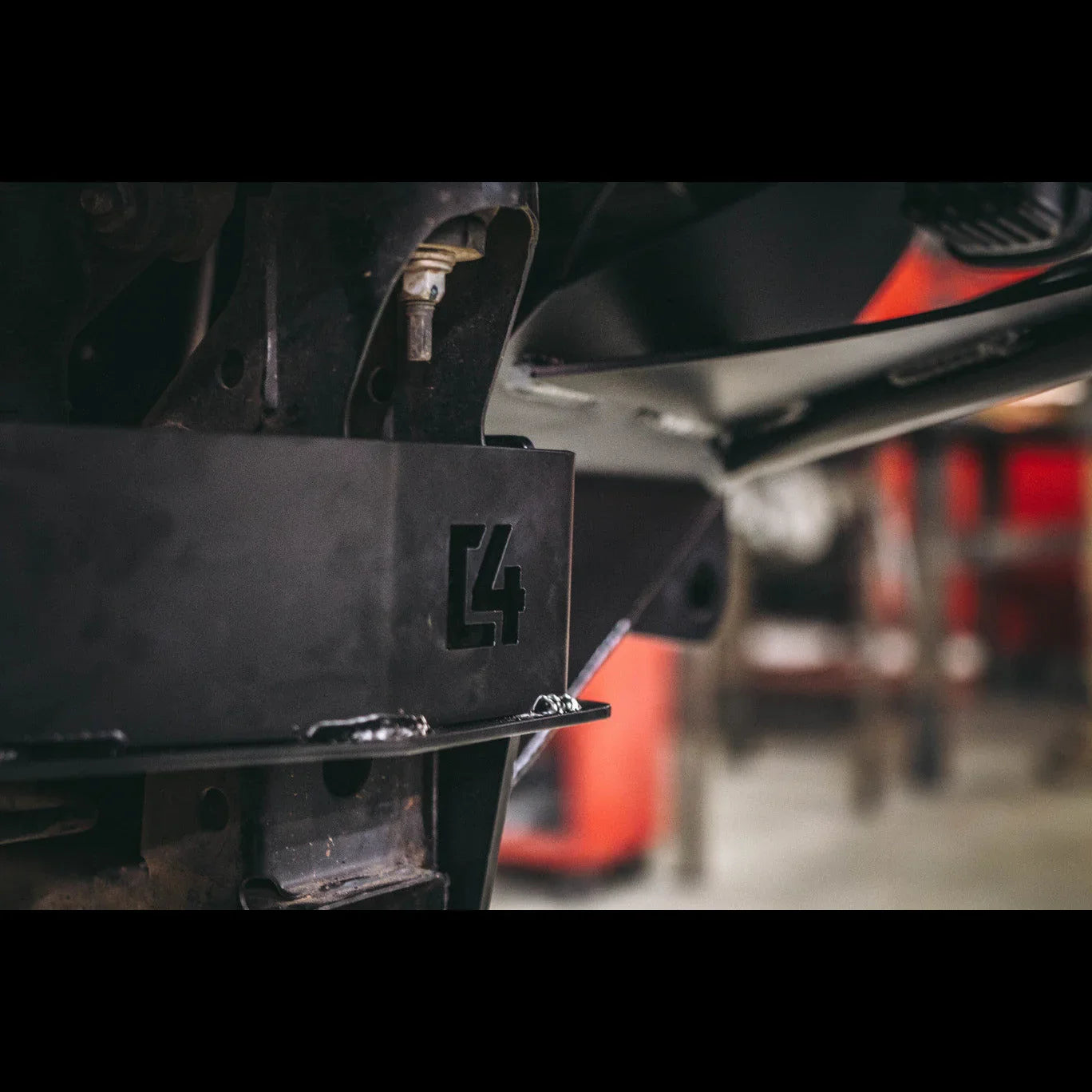 Close-up of heavy duty steel bumper mount with C4 cutout for off-road vehicle