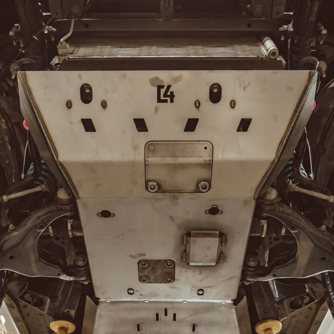 Heavy-duty steel skid plate installed on vehicle undercarriage for off-road protection
