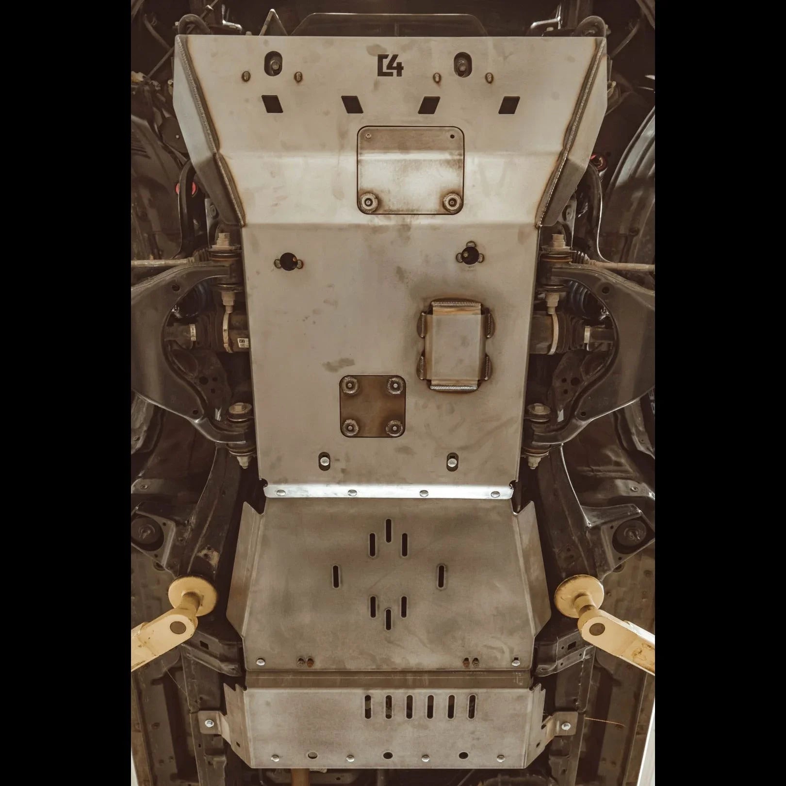 Heavy-duty skid plate installed under off-road vehicle for undercarriage protection