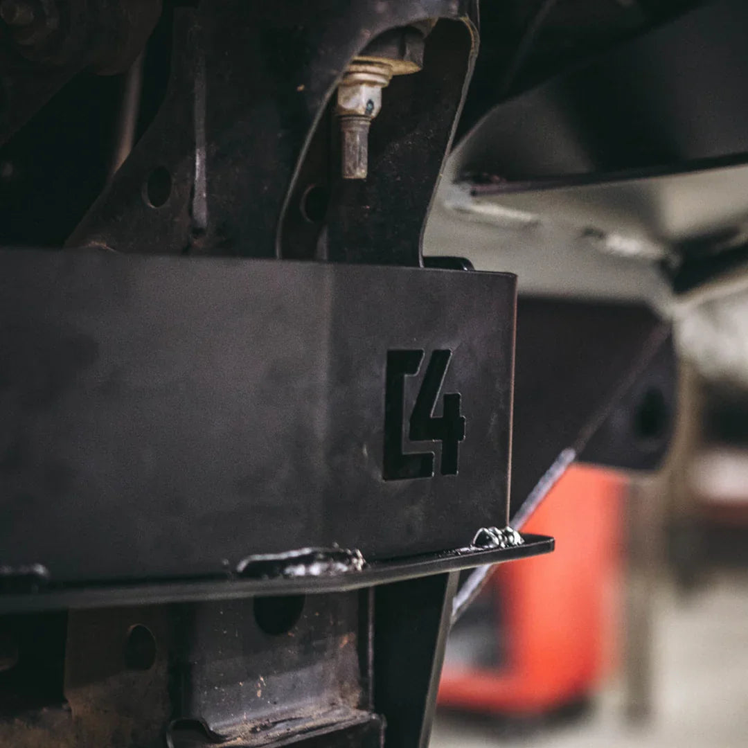 Steel front bumper support installed on Toyota Tacoma chassis, closeup detail view