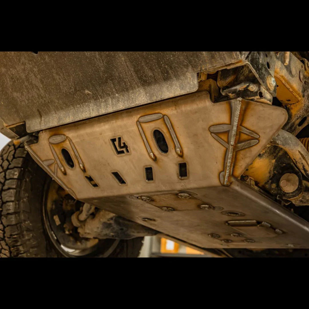 Heavy-duty steel skid plate installed under off-road vehicle for undercarriage protection