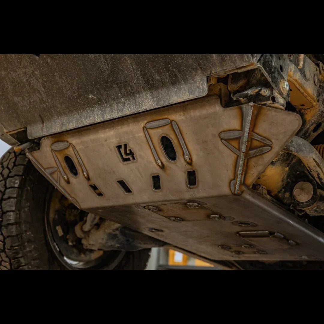 Heavy-duty off-road skid plate installed under vehicle, protecting undercarriage components.