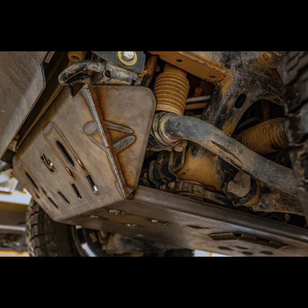 Heavy-duty off-road skid plate installed under vehicle chassis for suspension and differential protection