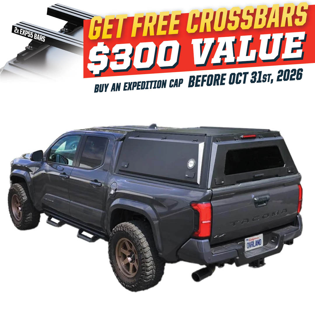 Overland Vehicle Systems Expedition PRO stainless steel truck cap with wing doors on a 2024 Toyota Tacoma