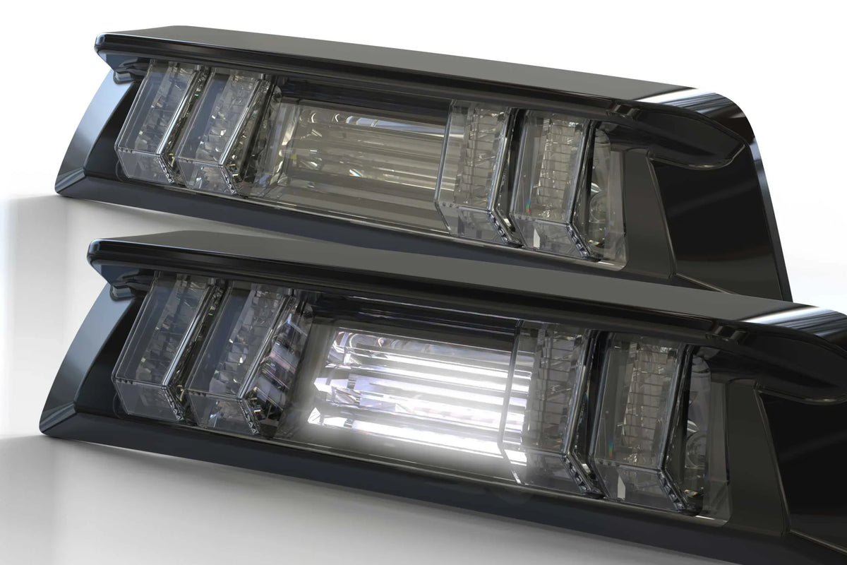 Pair of clear LED tail lights for Toyota Tacoma, modern automotive accessory close-up