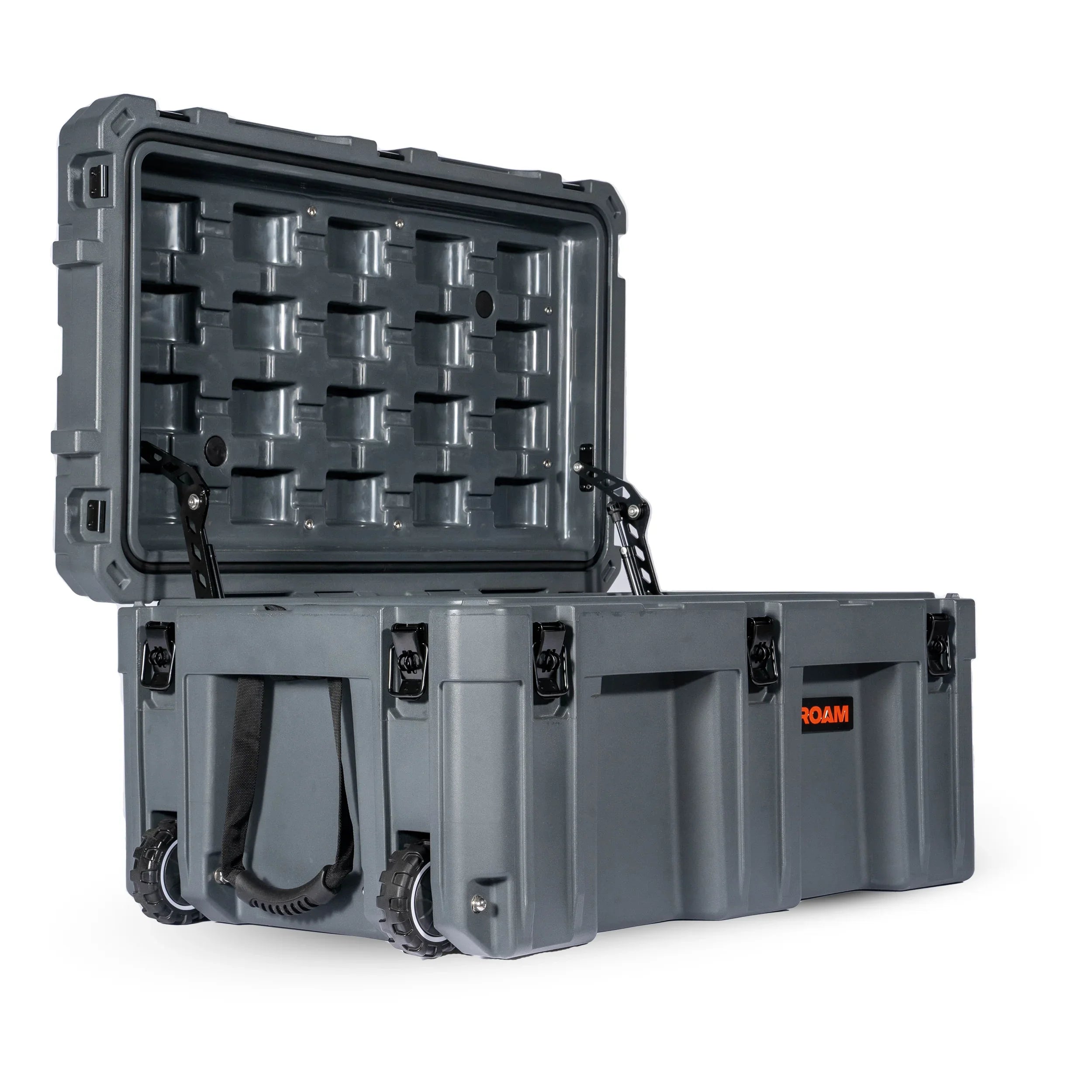 Heavy-duty gray storage case with wheels and open lid for overlanding vehicle gear