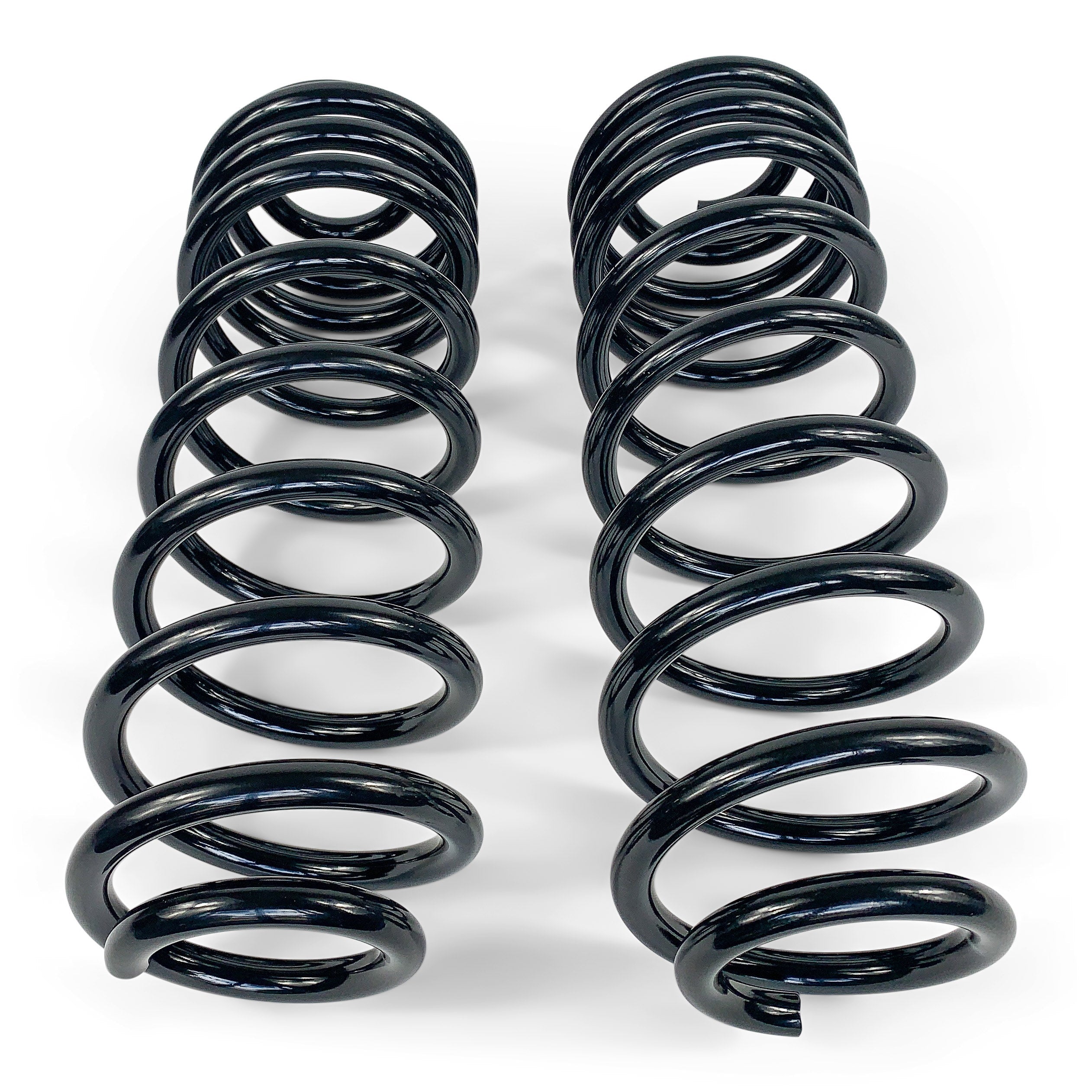 Pair of black heavy-duty coil springs for off-road vehicle suspension on white background