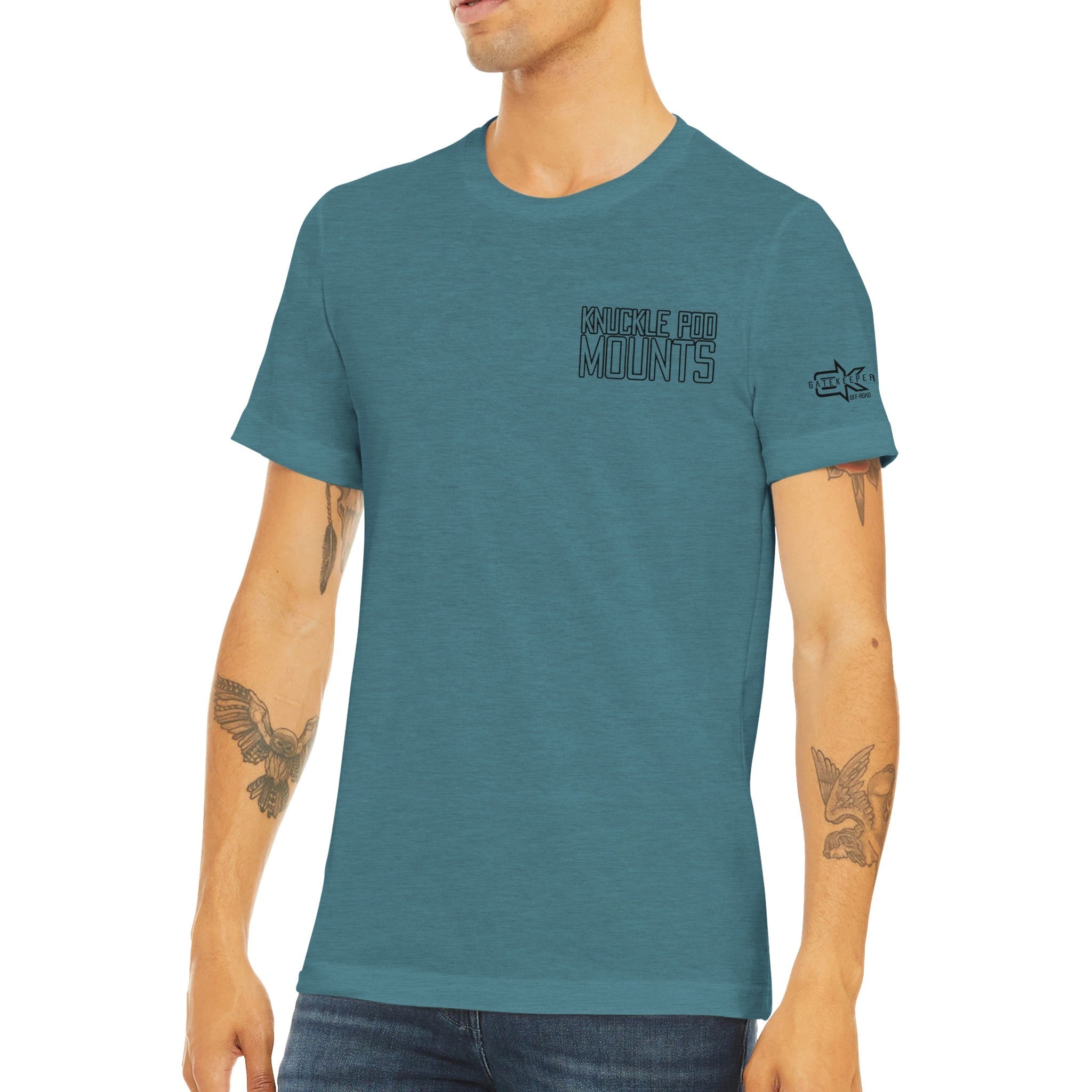Man wearing blue Knuckle Pod Mounts t-shirt with adventure tattoos, front view