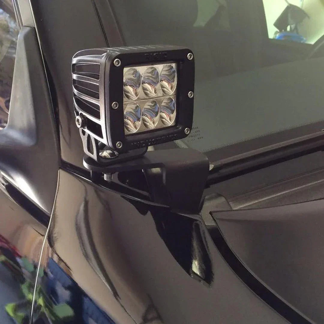 Ditch light bracket with LED pod installed on Toyota Tacoma or 4Runner hood