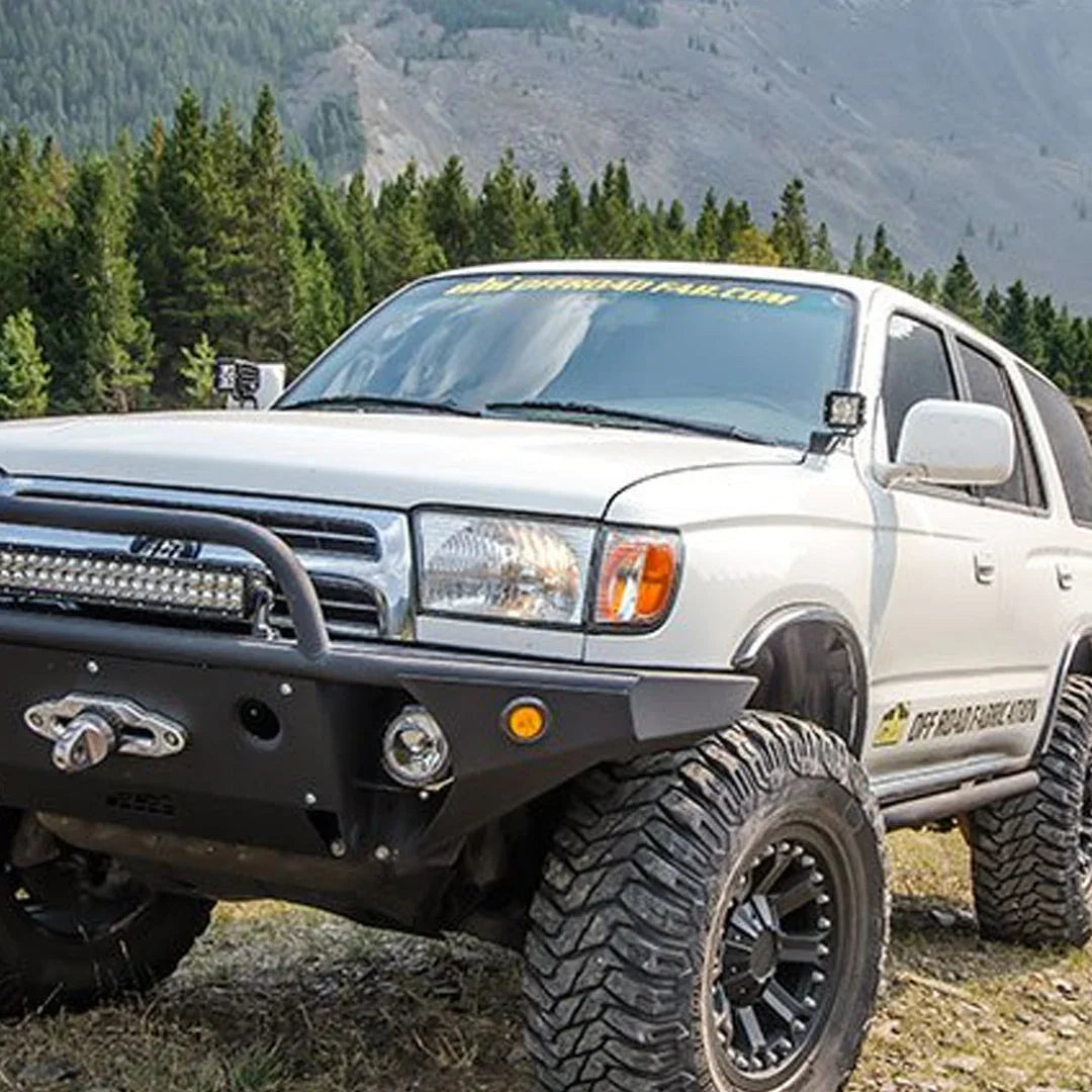 Toyota 4Runner with ditch light brackets and off-road bumper in outdoor mountain setting