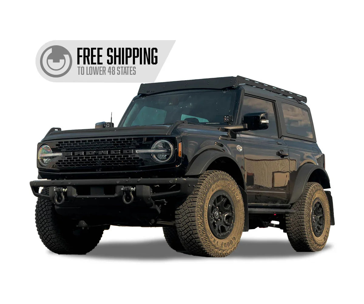 2-door Ford Bronco with Prinsu roof rack and off-road tires, ideal for overlanding gear