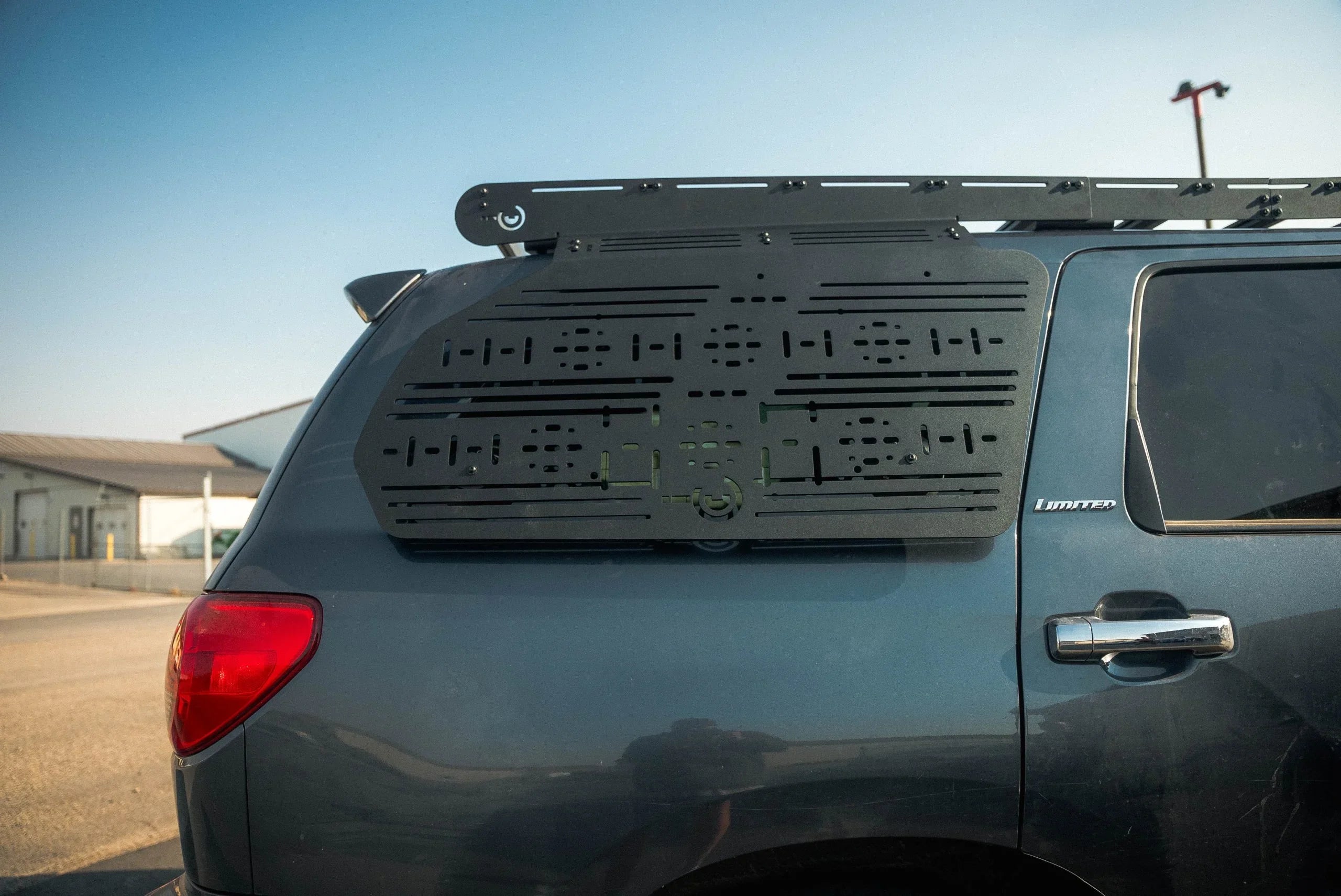 Toyota Sequoia overland roof rack and modular side panel accessory in outdoor setting