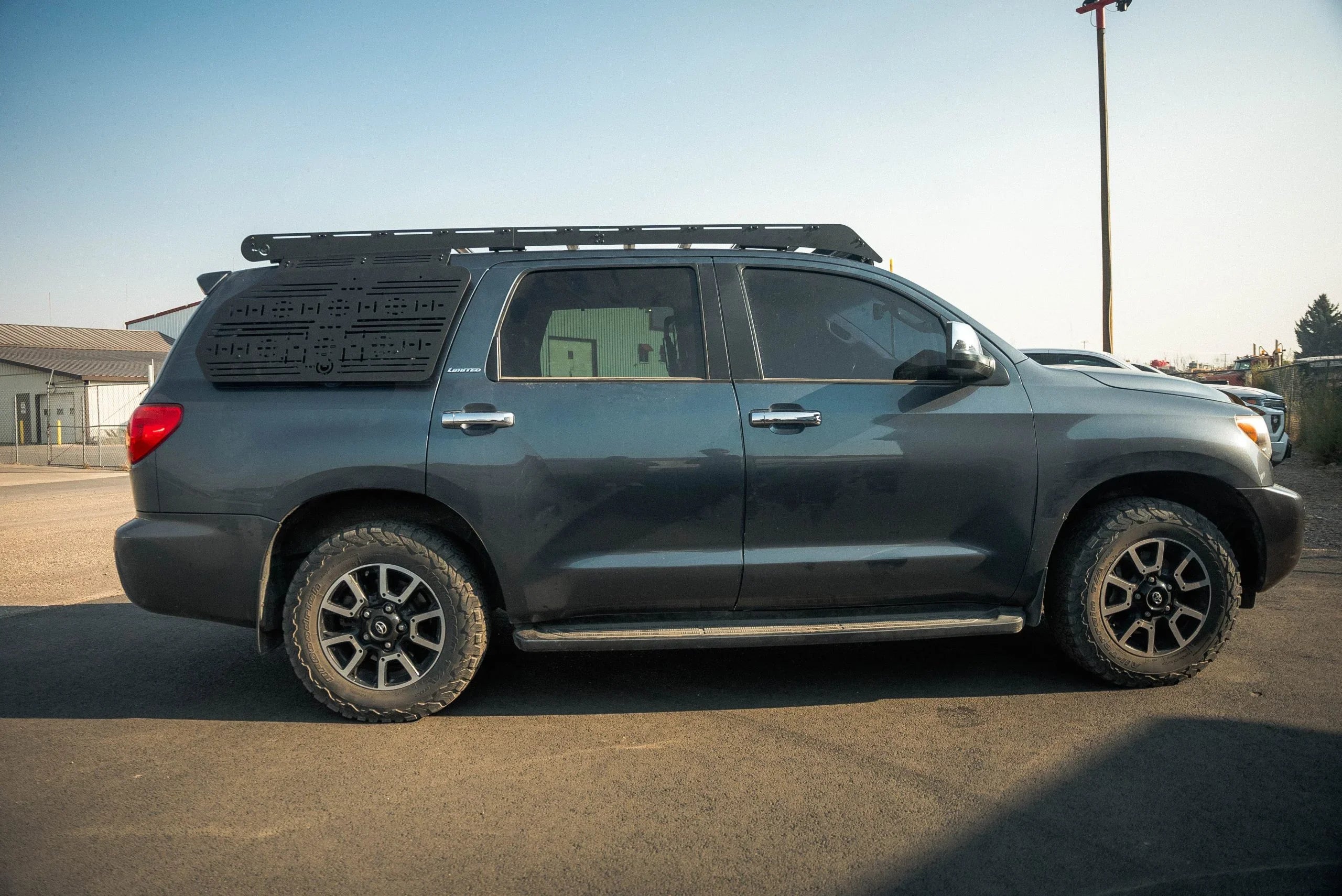Toyota SUV with roof rack and side panel for overlanding and expedition gear