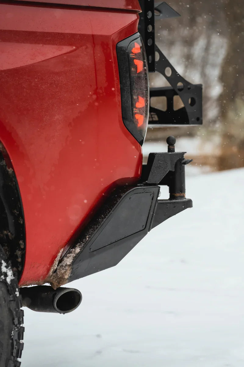 Toyota Tundra rear swing-out bumper with off-road accessory in snowy outdoors