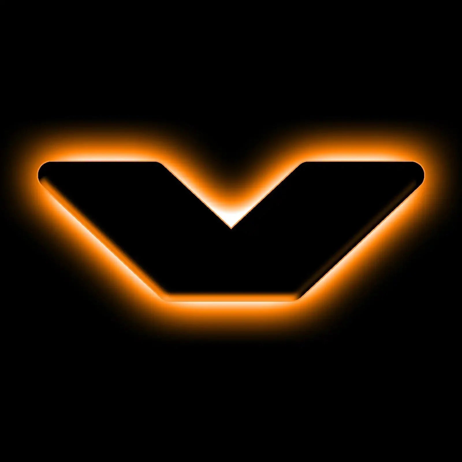Black chevron emblem with orange LED backlight, overlanding vehicle accessory logo