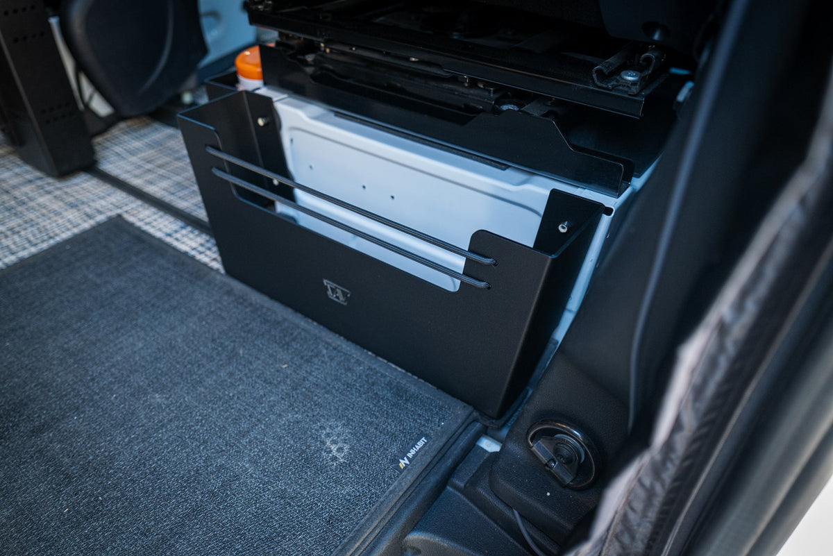 Sprinter seat base storage cubby holding everyday essentials