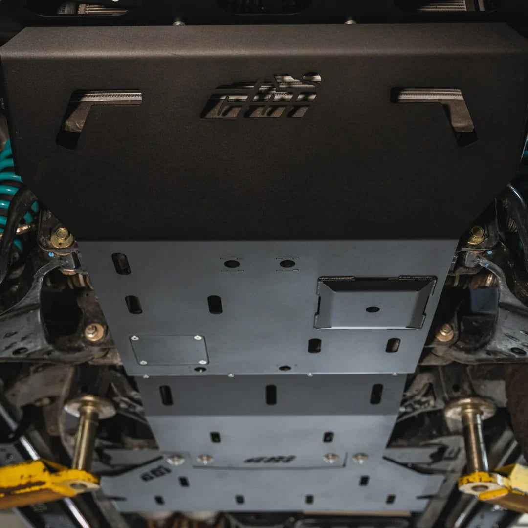 Heavy-duty skid plate installed under 3rd gen Nissan Frontier for off-road protection