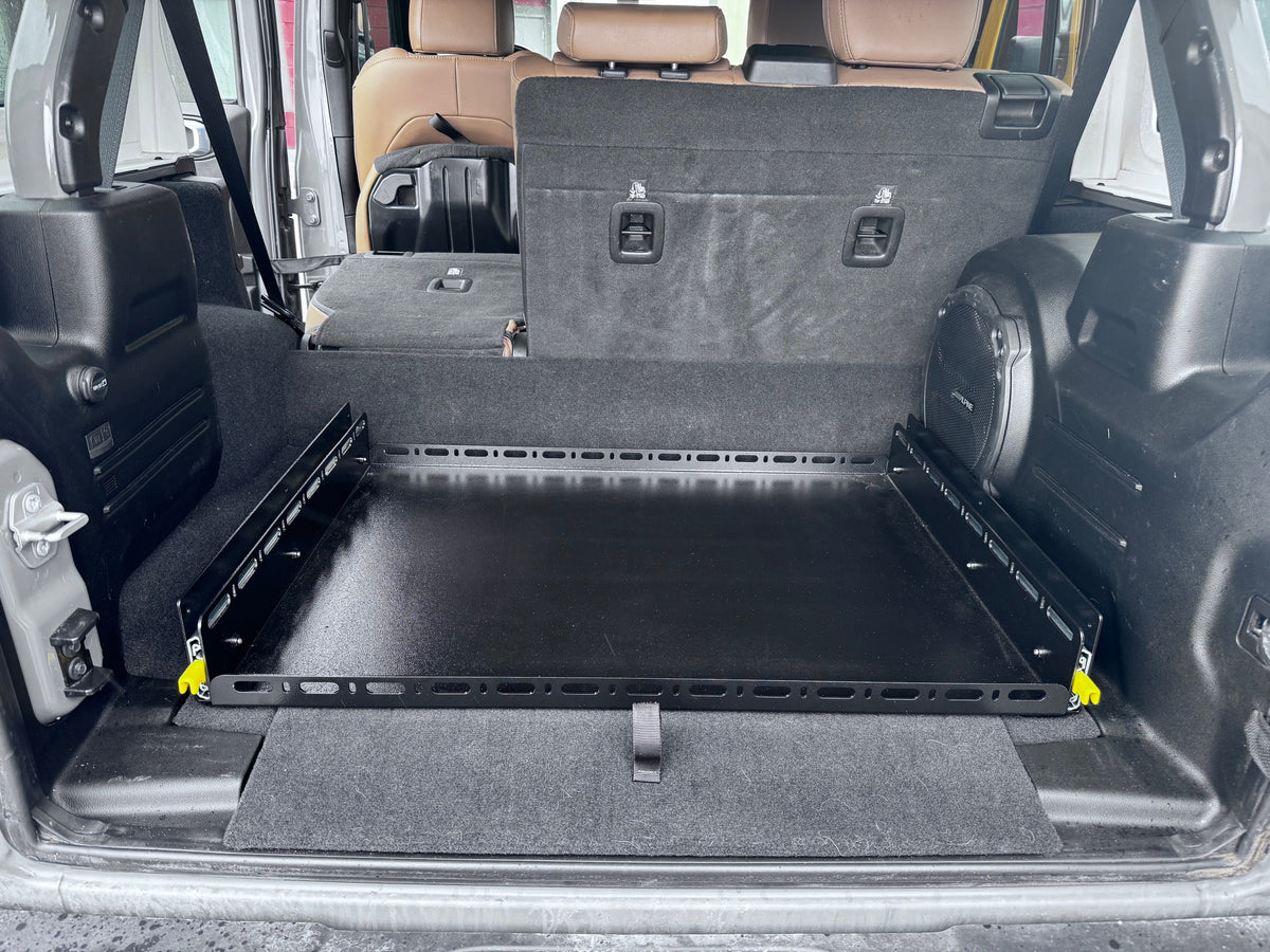 Diabolical Inc Slide Floor 2.0 extended from a Jeep Wrangler JLU