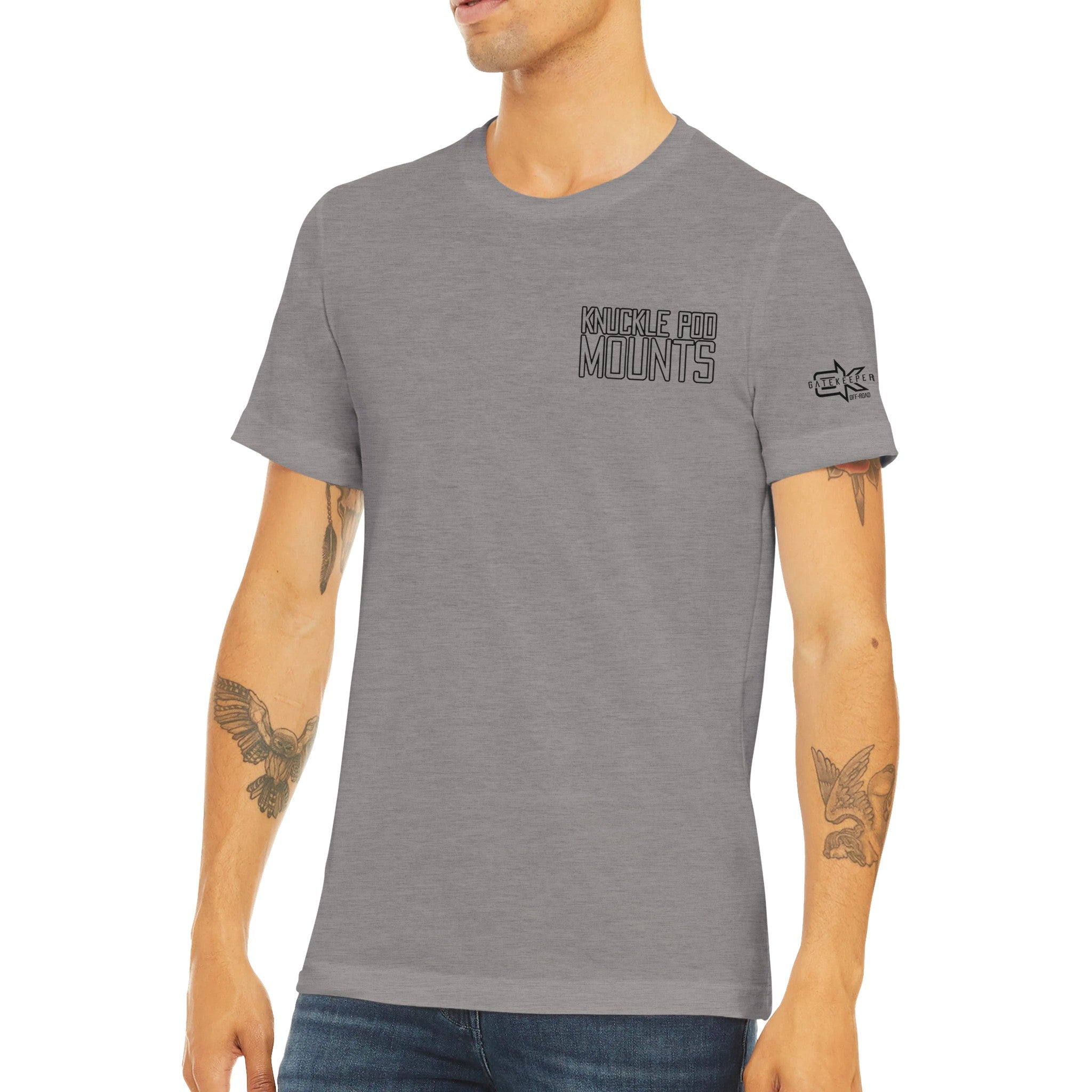 Man wearing grey Knuckle Pod Mounts t-shirt with sleeve logo, casual outdoor apparel