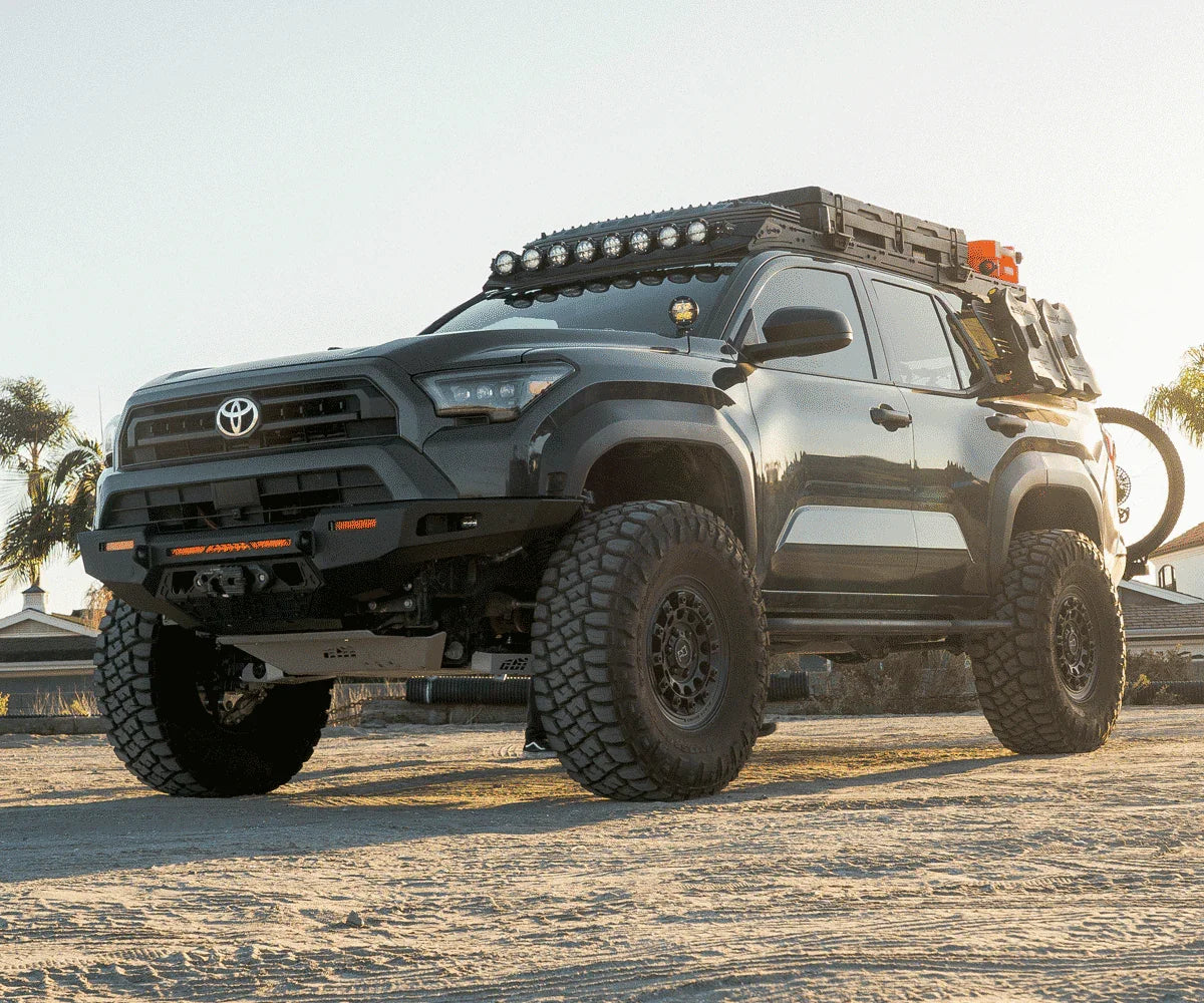 Lifted Toyota 4Runner with off-road tires, roof rack, and overlanding accessories outdoors