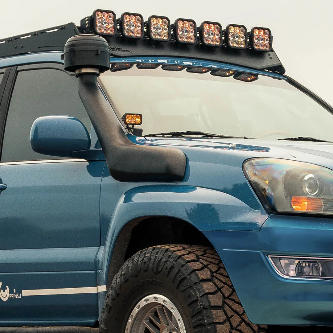 4th Gen Toyota 4Runner GX470 with ditch light brackets, roof lights, snorkel, off-road tires