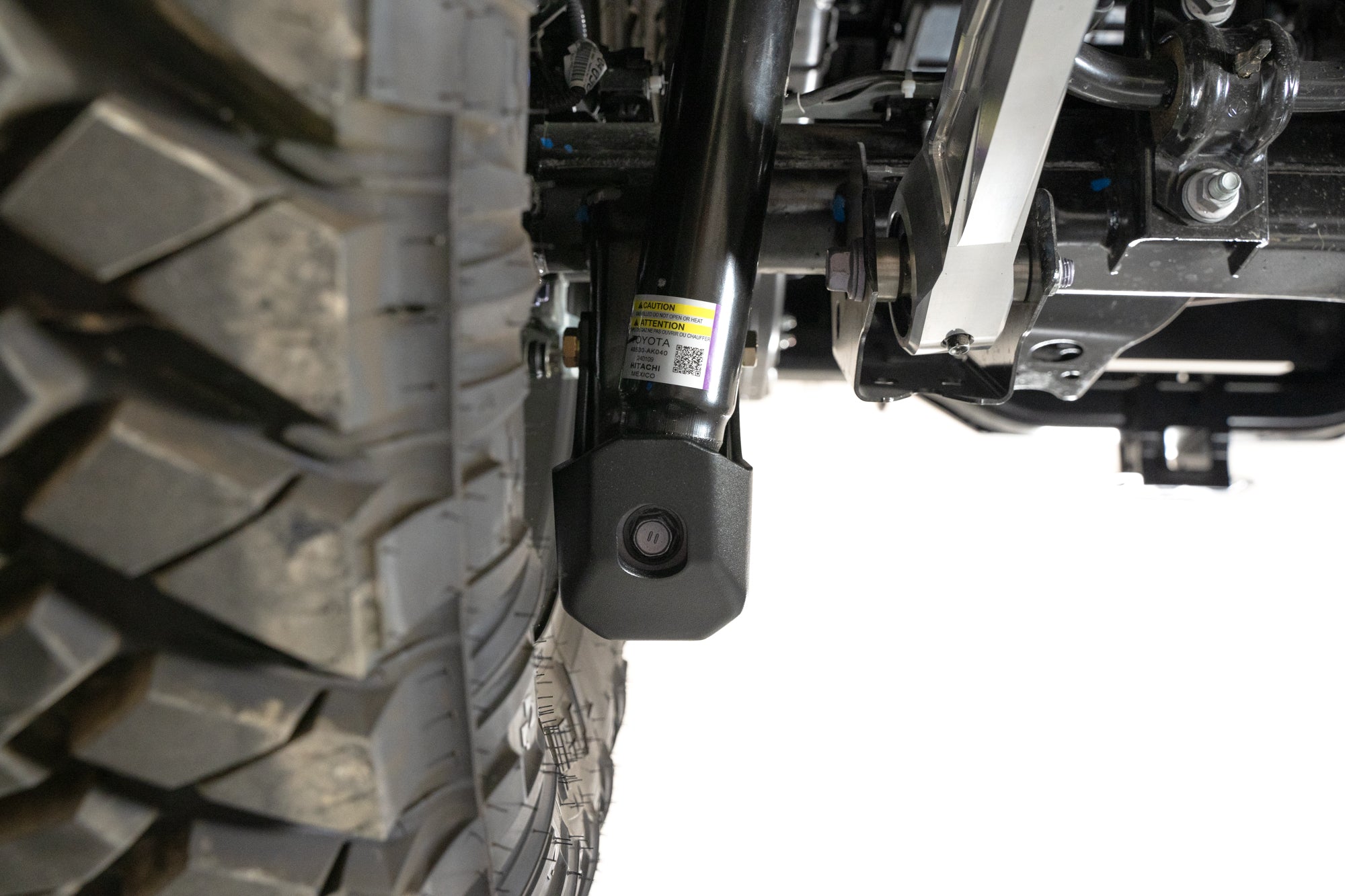4th-gen-Toyota-Tacoma-Rear-Shock-Guards-Installed-10 - NVMOS