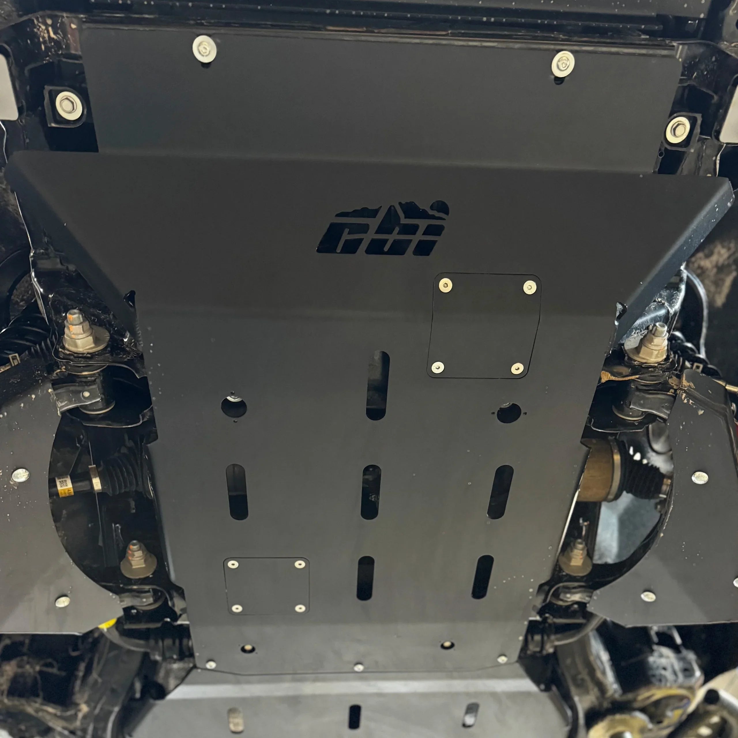 Toyota Tacoma 4th gen front skid plate installed under vehicle for off-road protection
