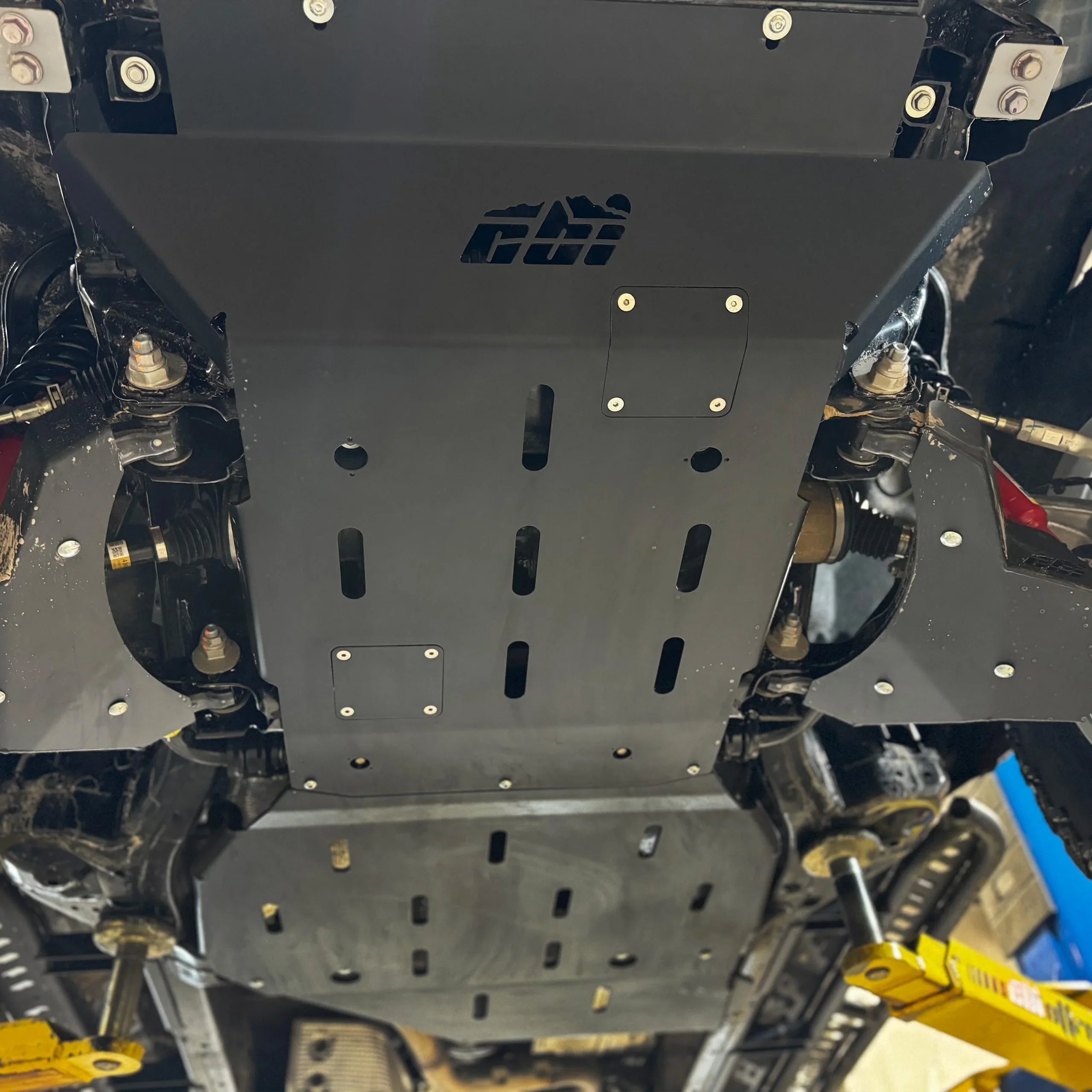 Heavy-duty skid plates installed under Toyota Tacoma for off-road protection