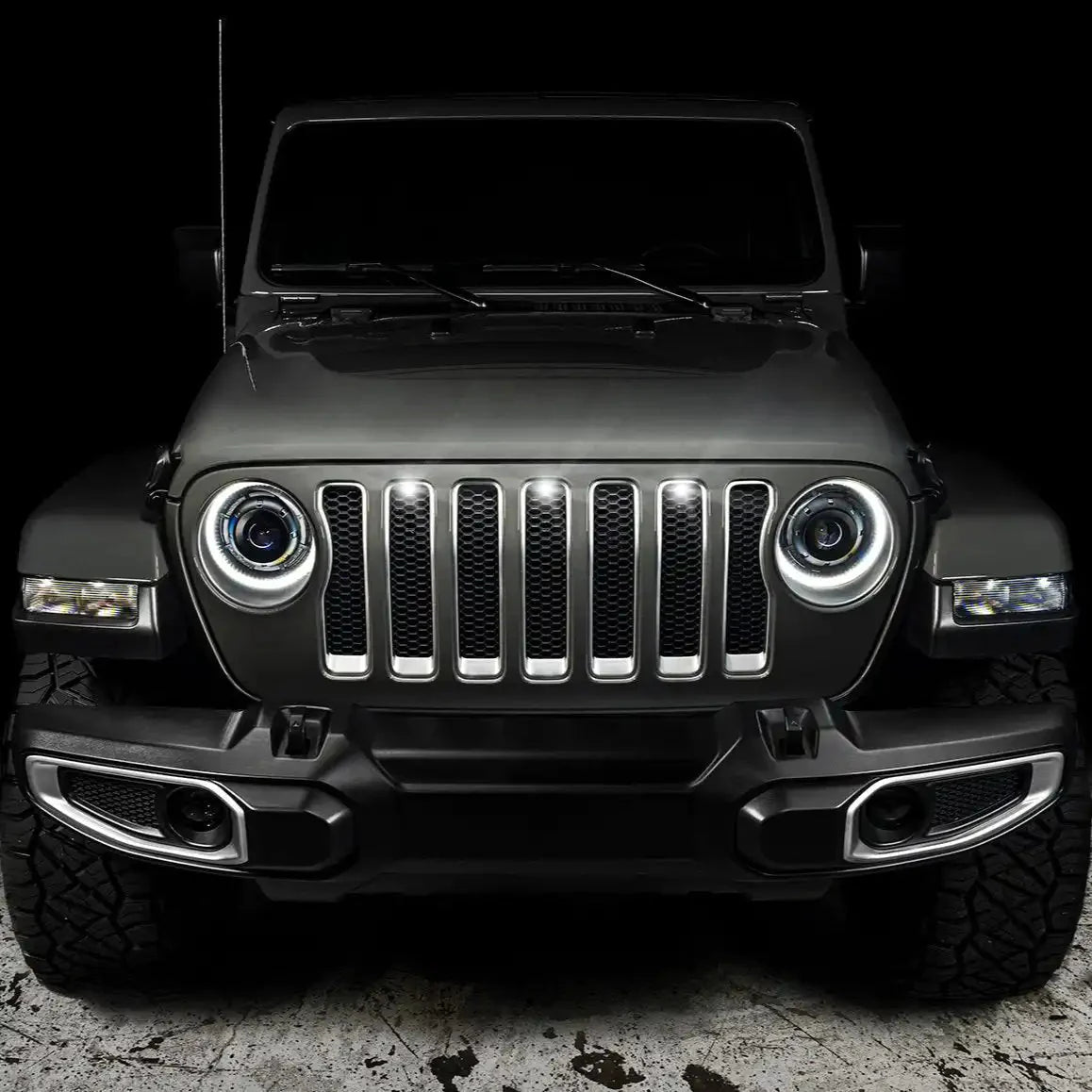 Front view of Jeep Wrangler with round LED headlights and rugged off-road bumper