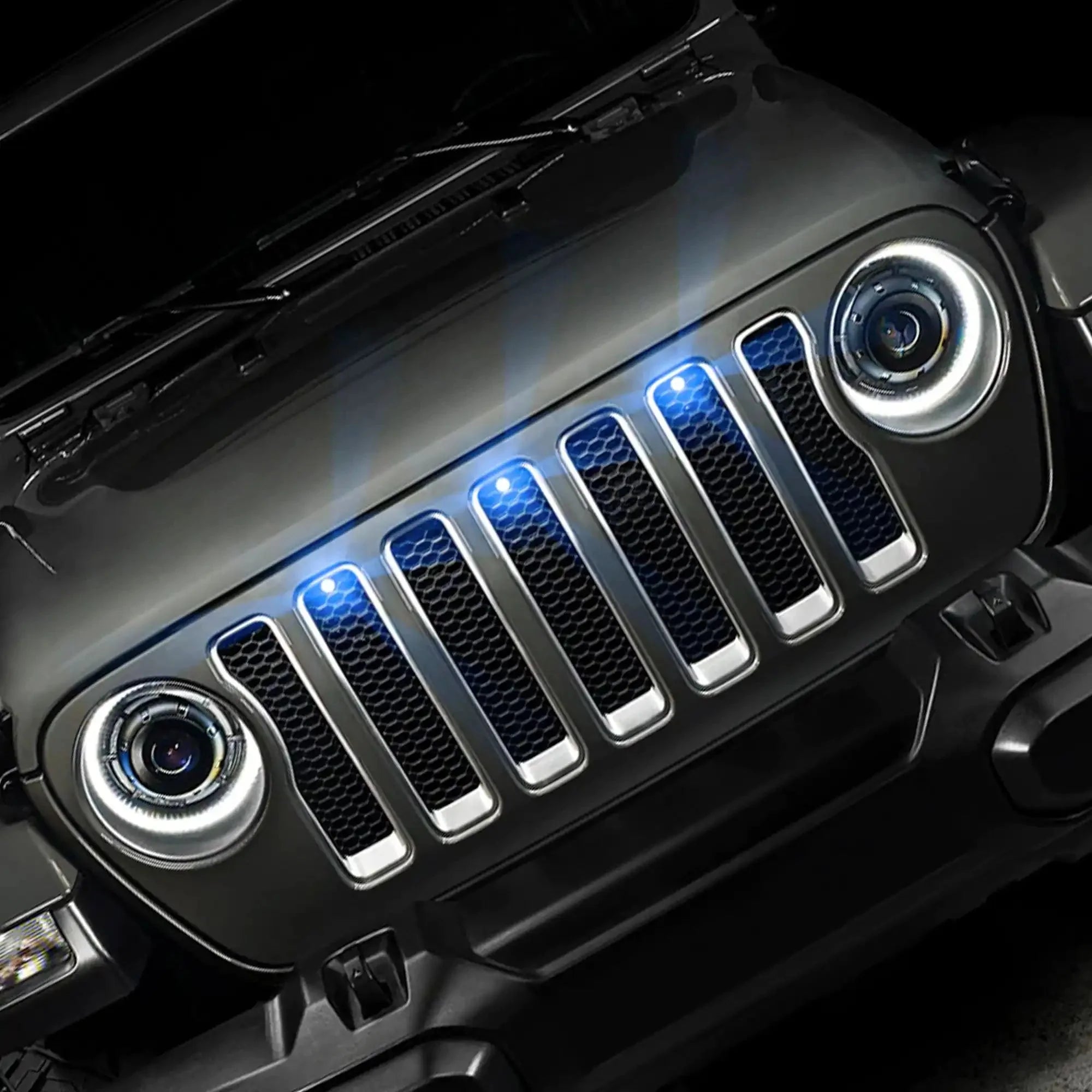 Jeep Wrangler front grille with LED halo headlights and blue grille marker lights