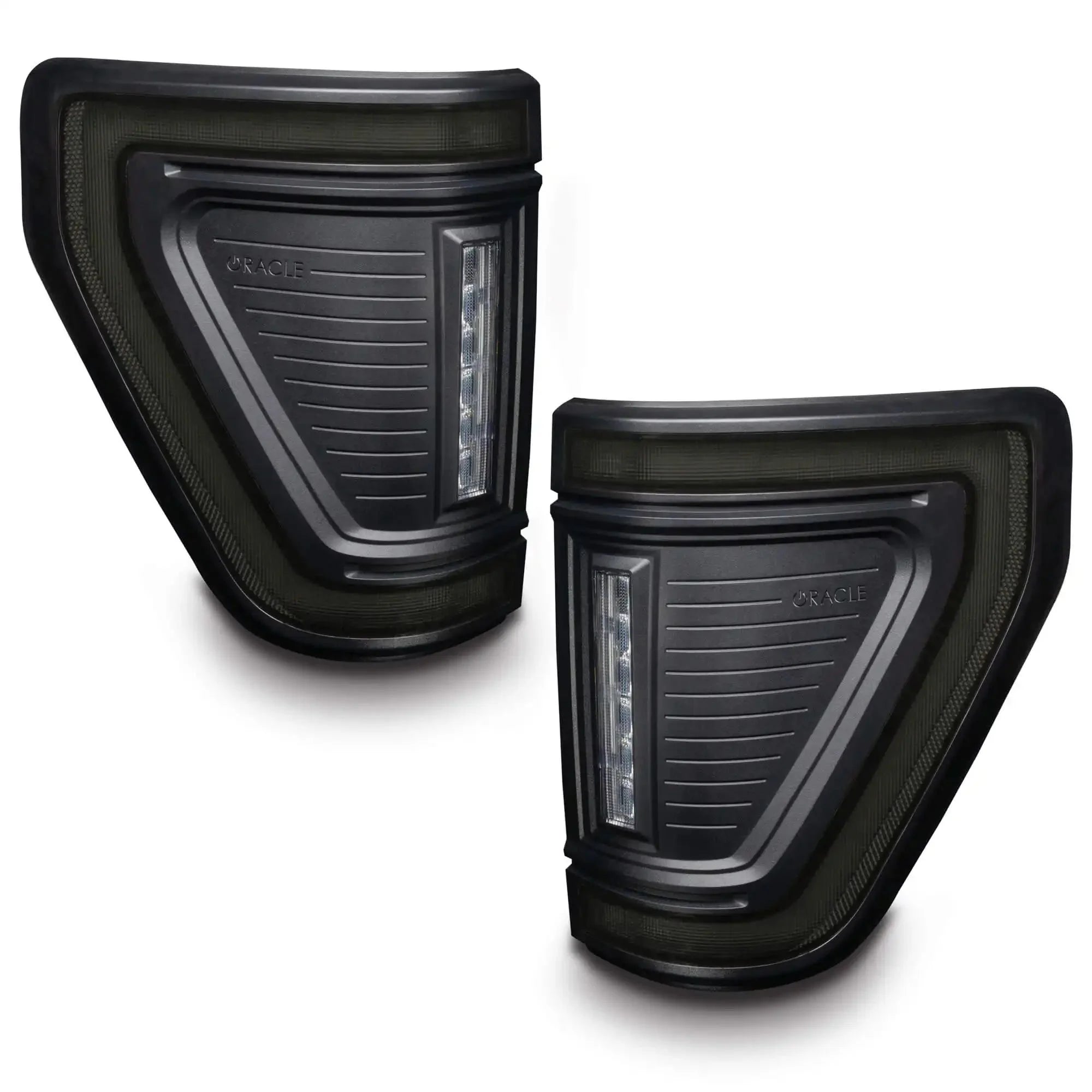 Pair of black LED sequential tail lights for Toyota Tacoma, angled view on white background