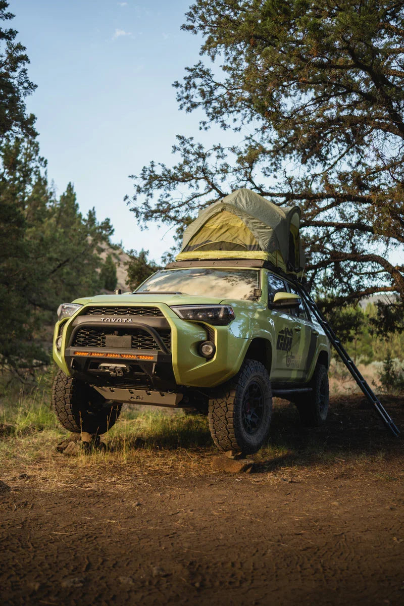 Toyota 4Runner with roof rack and rooftop tent parked outdoors for overlanding camping