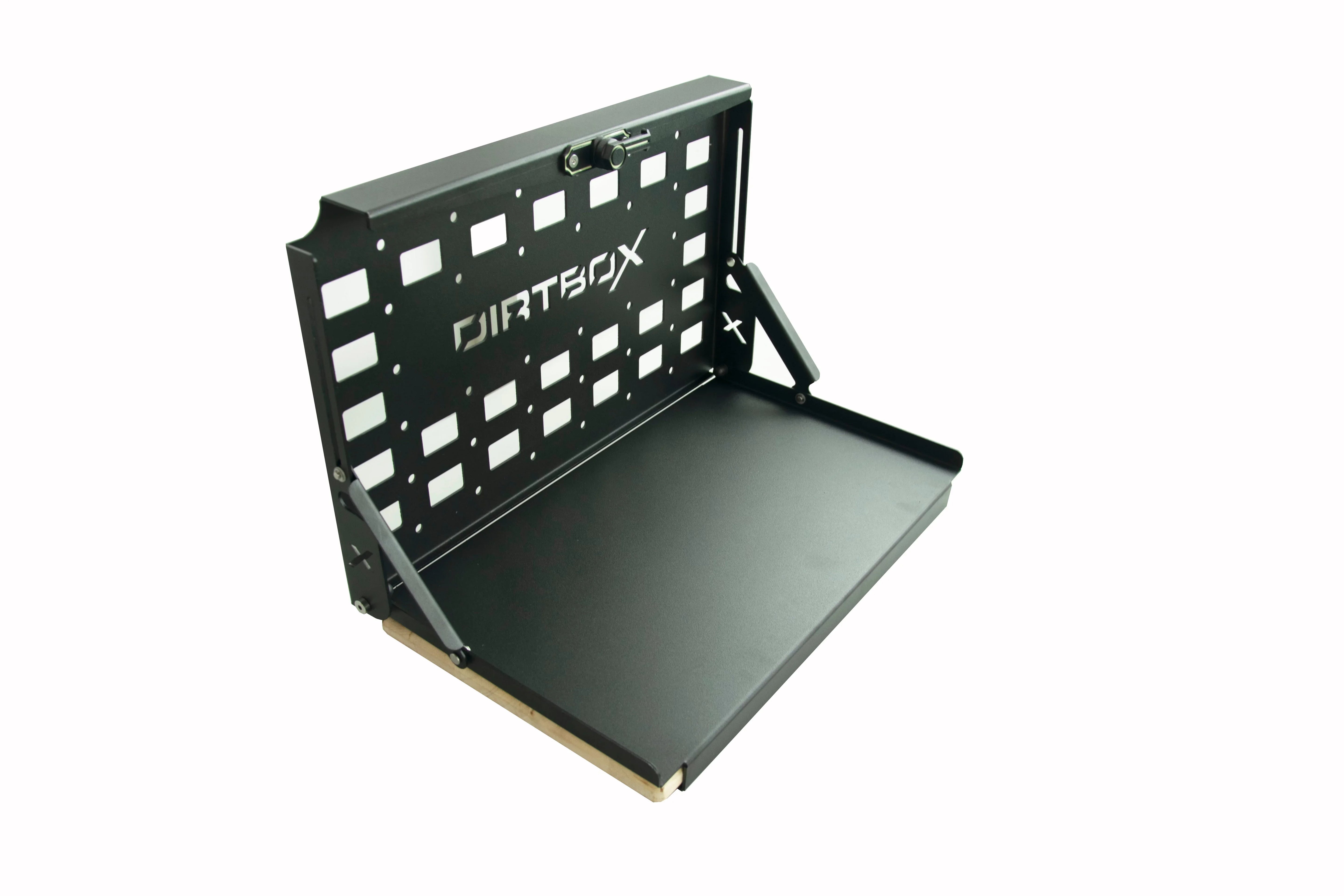 Black metal fold-down tailgate table with cutout pattern, ideal for overlanding vehicles