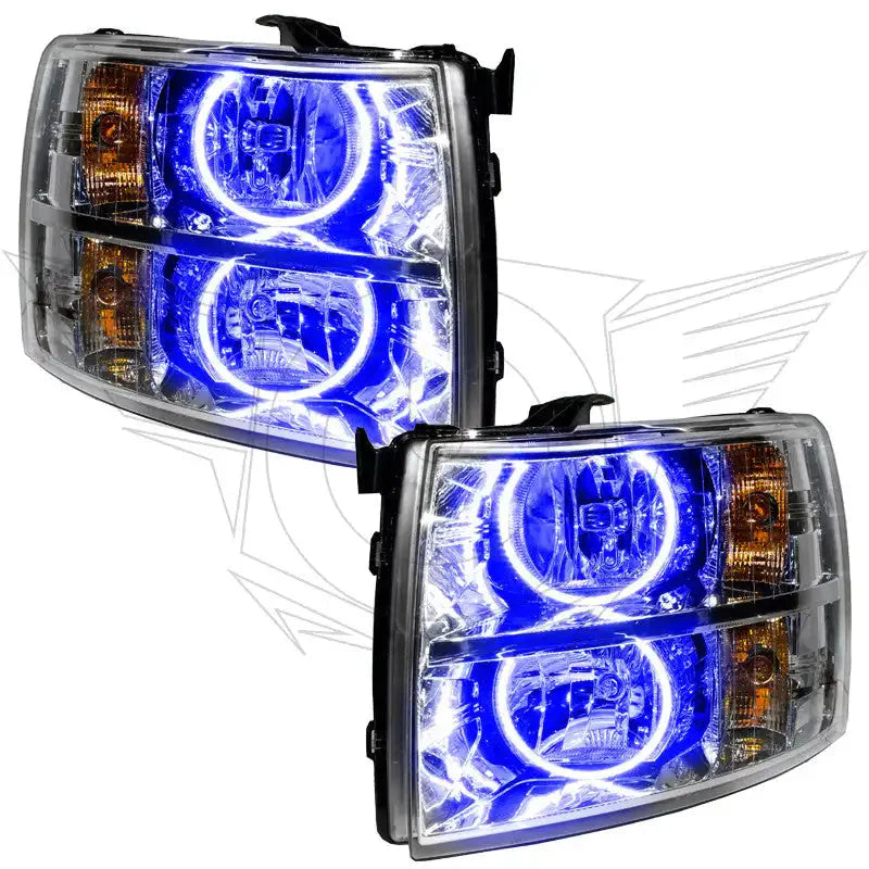Pair of aftermarket projector headlights with blue LED halo rings for trucks or SUVs