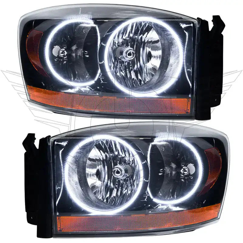 Pair of aftermarket LED halo projector headlights with clear lenses and amber side reflectors
