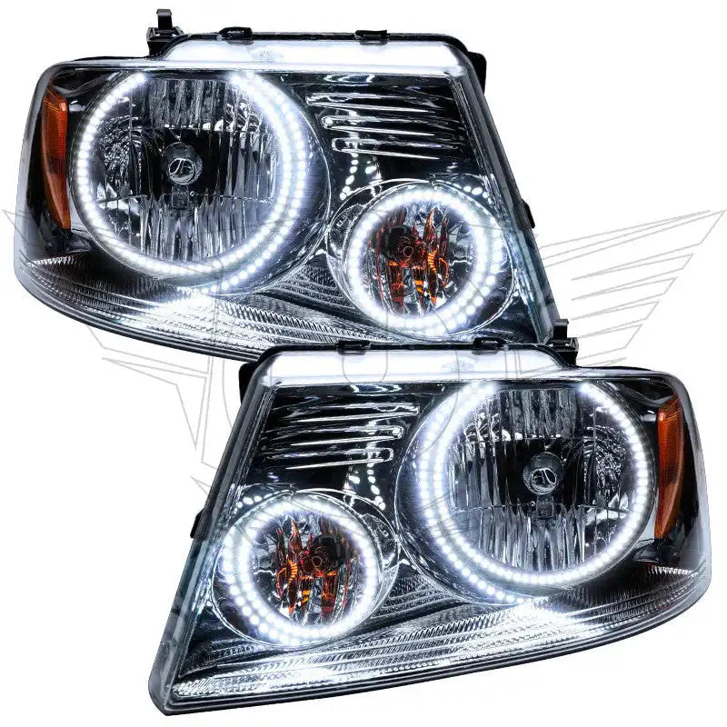 Pair of clear LED halo projector headlights for Toyota Tacoma, chrome housing, white DRL rings