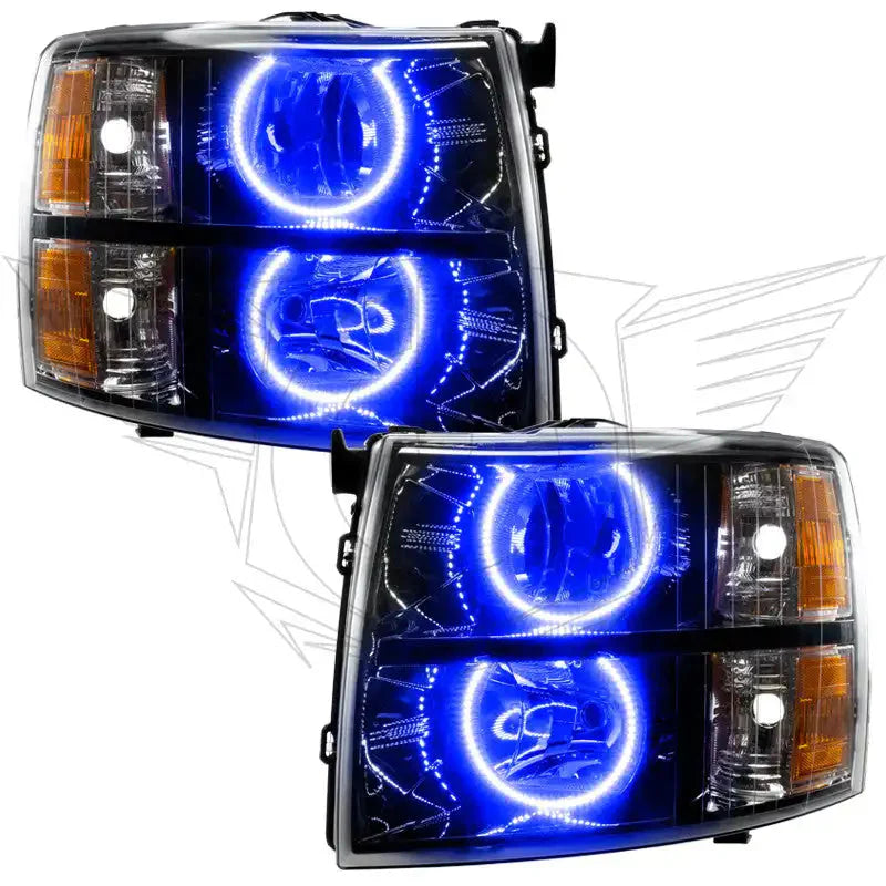 Pair of custom automotive headlights with bright blue and white LED halo rings