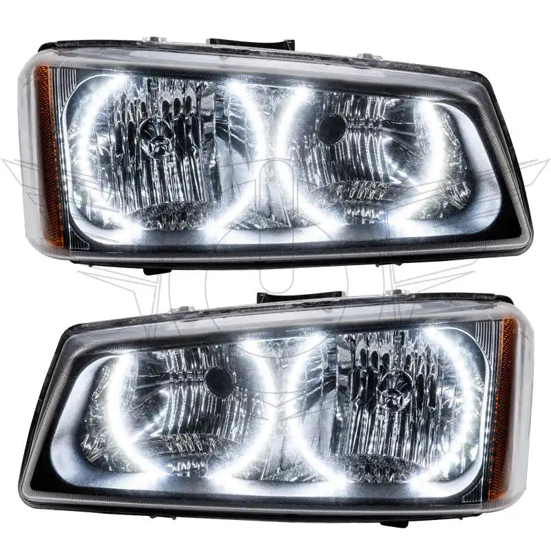 Pair of aftermarket LED halo projector headlights with clear lenses for off-road vehicles