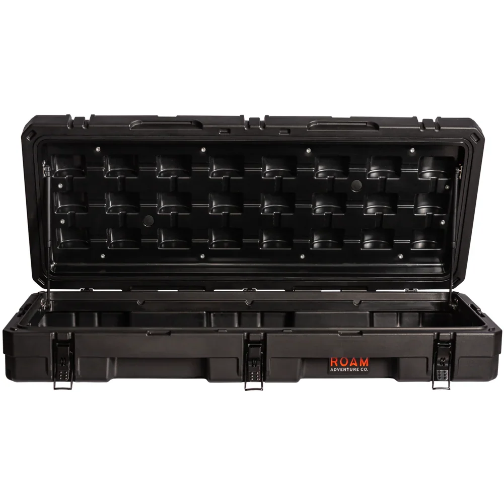 Black heavy-duty rooftop cargo storage case with open lid, ideal for overlanding gear.