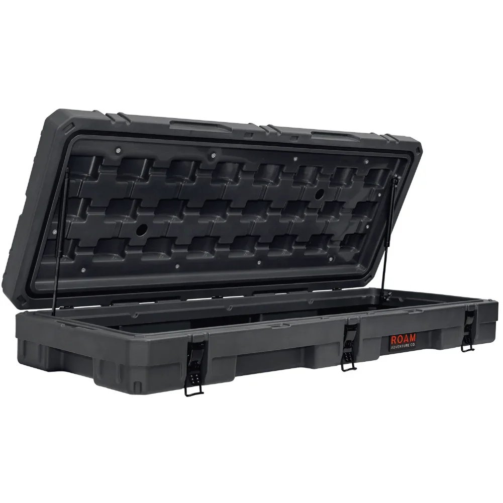 Heavy-duty black storage case with open lid and secure latches for overlanding gear